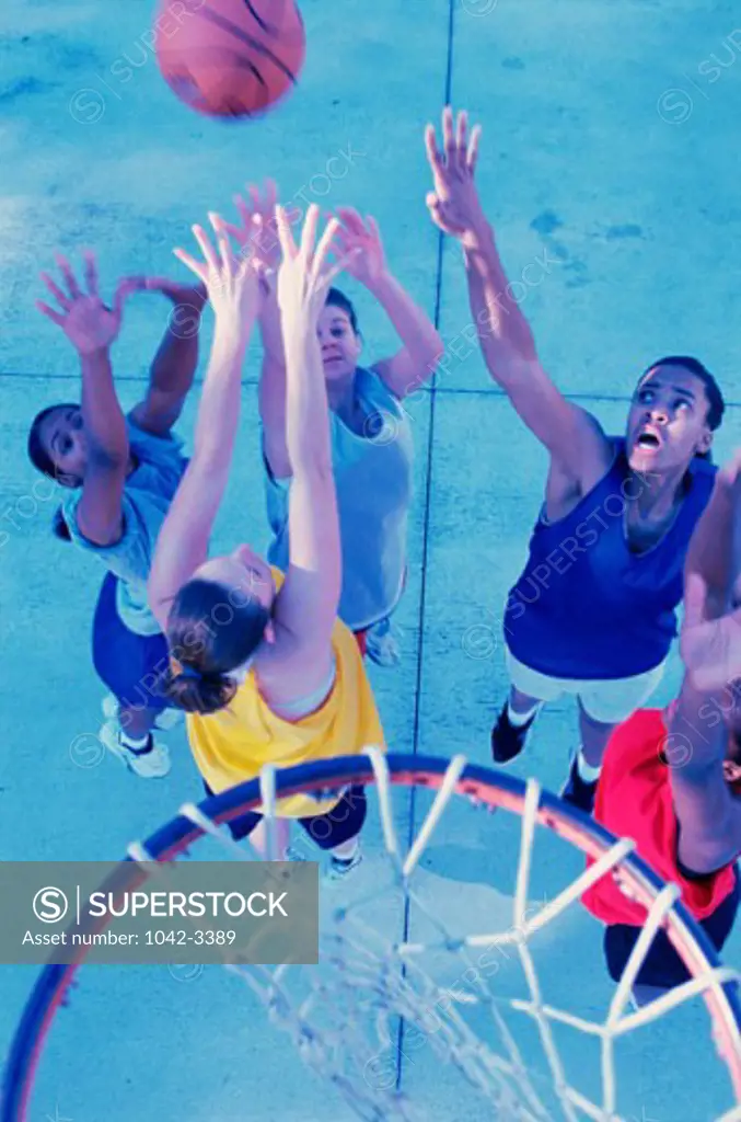 High angle view of a group of young women playing basketball