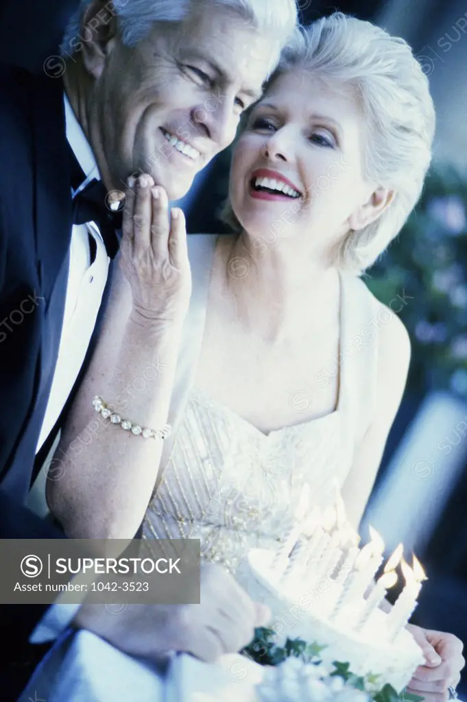 Close-up of a senior couple celebrating a birthday