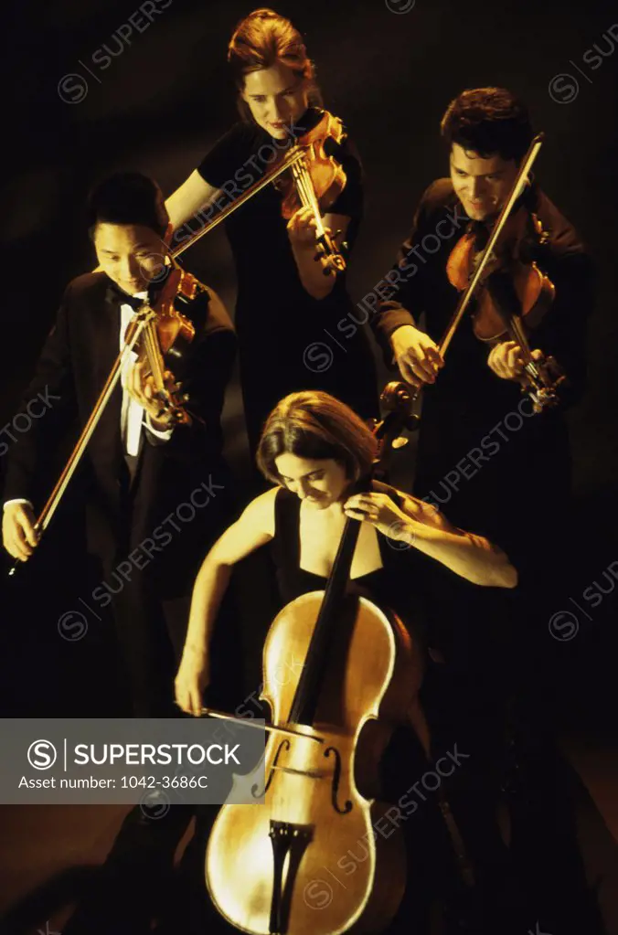 Group of young people playing violins and cello