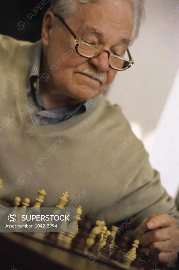 Senior man playing chess