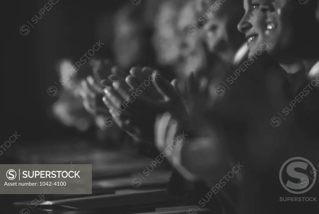 Side profile of a group of business executives sitting in a row
