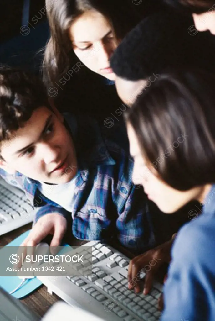 Group of teenagers in a computer class