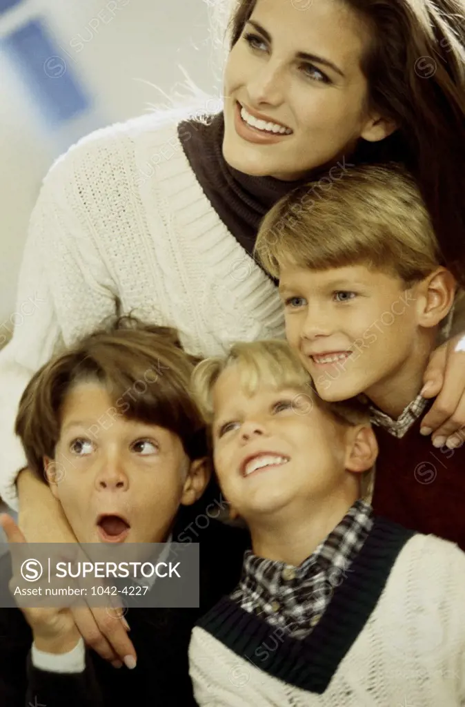 Close-up of a mother with her three sons