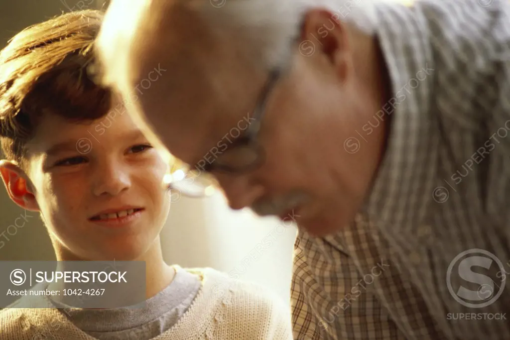 Grandson looking at his grandfather