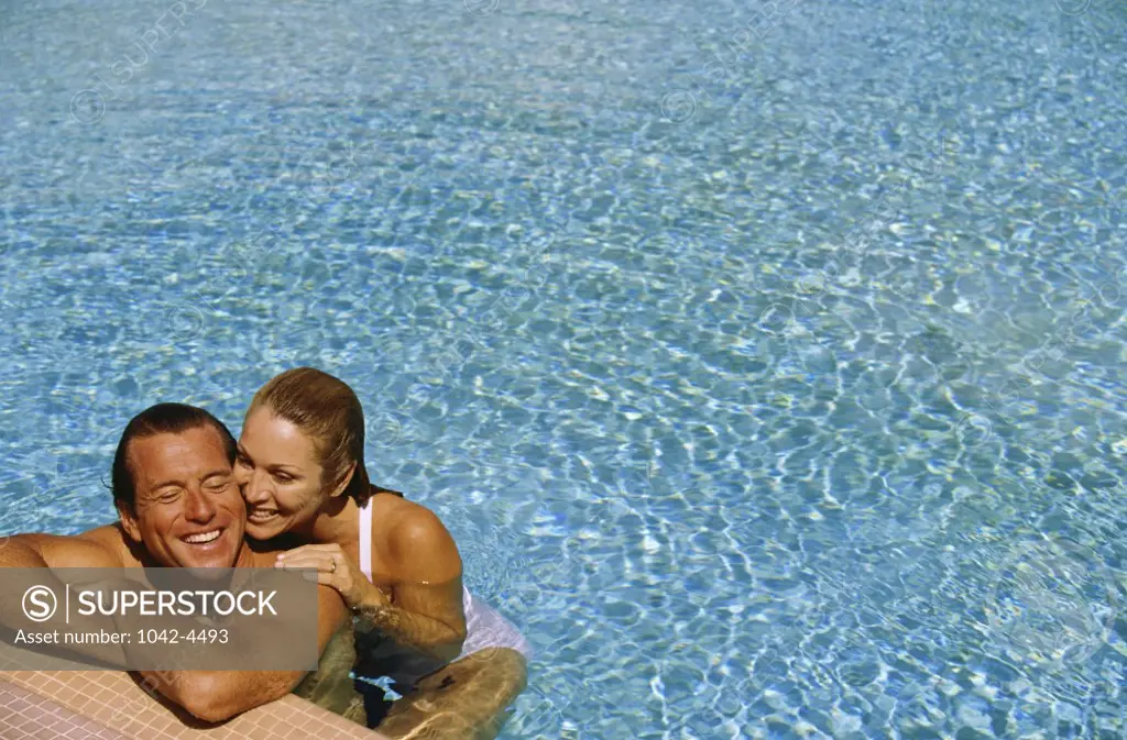 Mid adult couple in a swimming pool