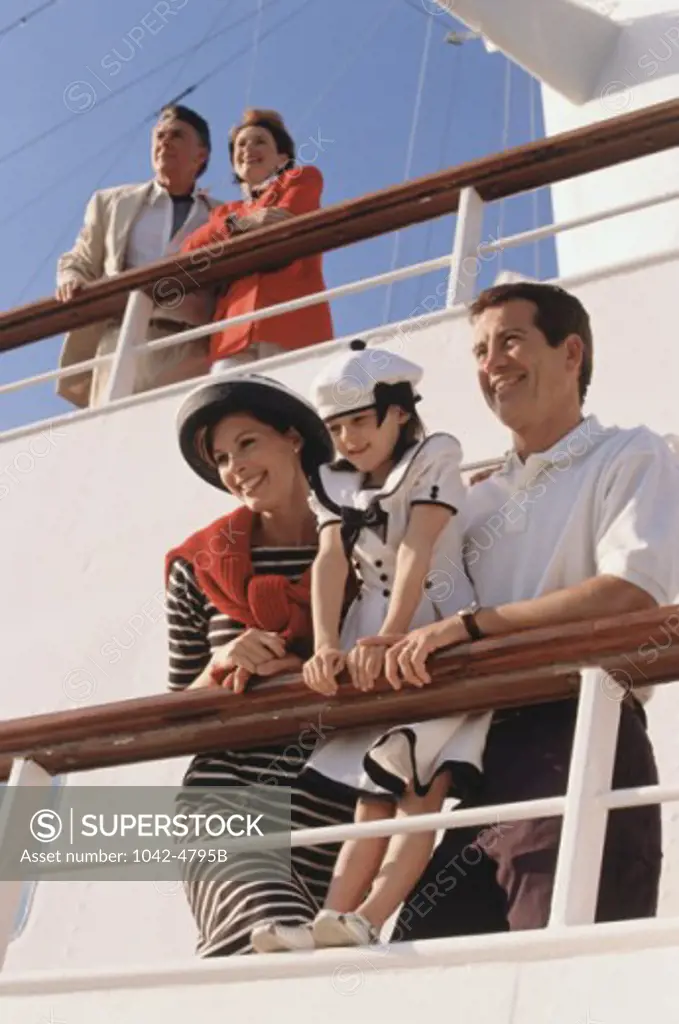 Low angle view of a family standing on a cruise ship