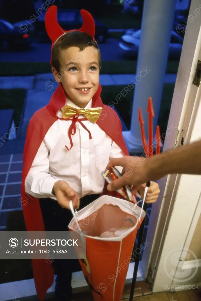 Boy trick or treating at Halloween