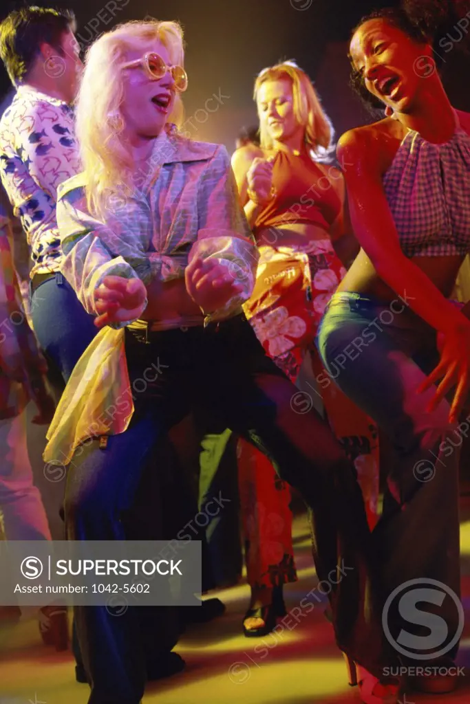Group of teenagers dancing at a nightclub