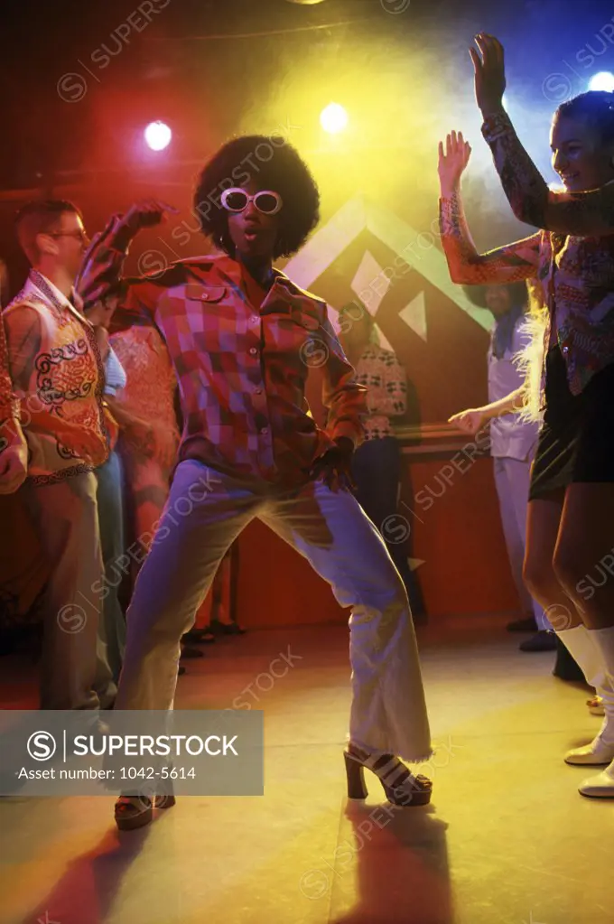 Group of people dancing at disco nightclub