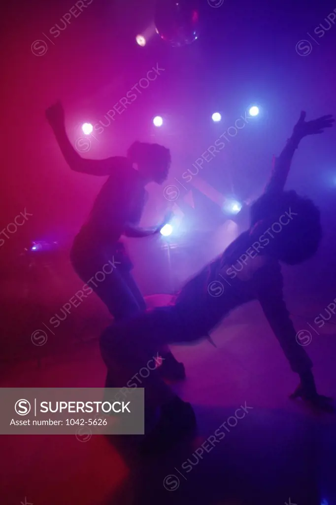 Teenage couple dancing at a nightclub