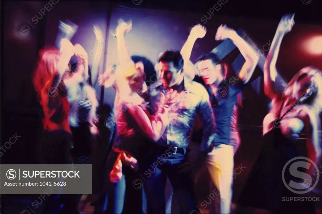 Group of teenagers dancing at a nightclub