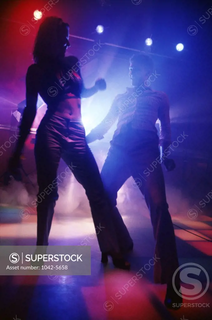 Two teenagers dancing at a nightclub
