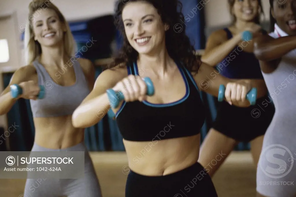 Group of young women exercising in an aerobics class