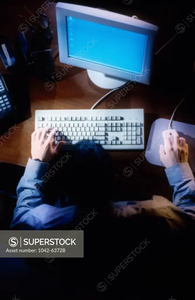 High angle view of a businessman using a computer
