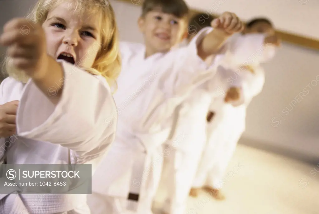 Group of children practicing karate