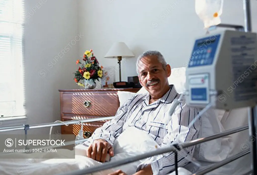 Male patient smiling in the bed