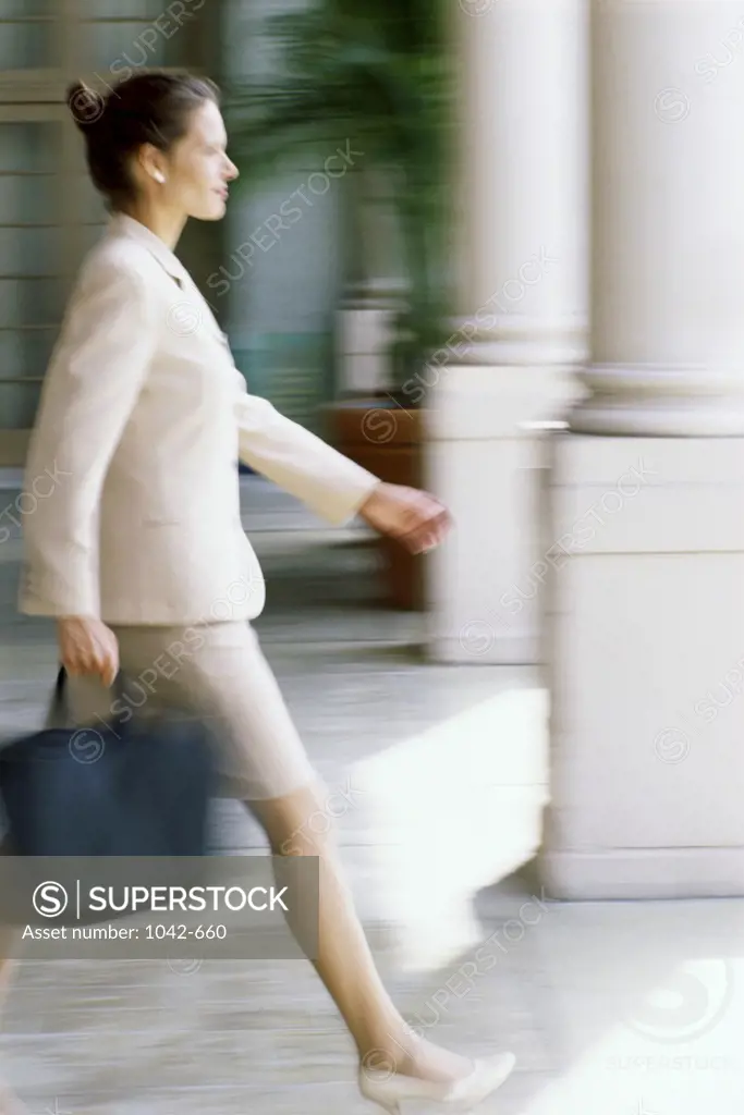 Businesswoman walking with a briefcase