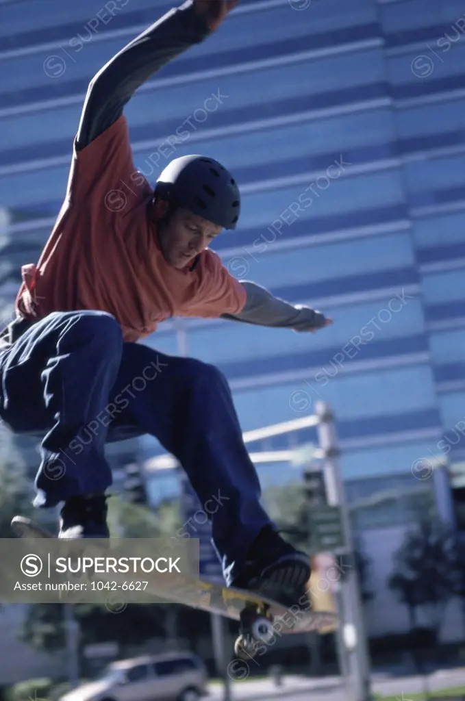 Young man skateboarding in mid air