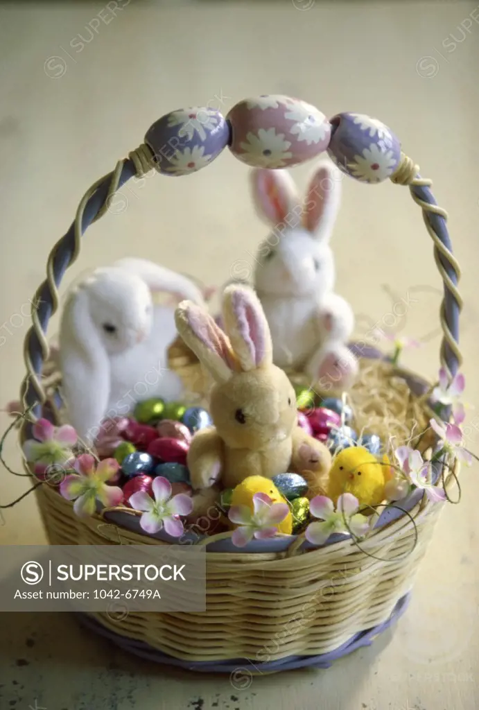 Stuffed Easter bunnies and a basket of candy