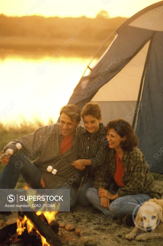 Parents with their son at a campsite