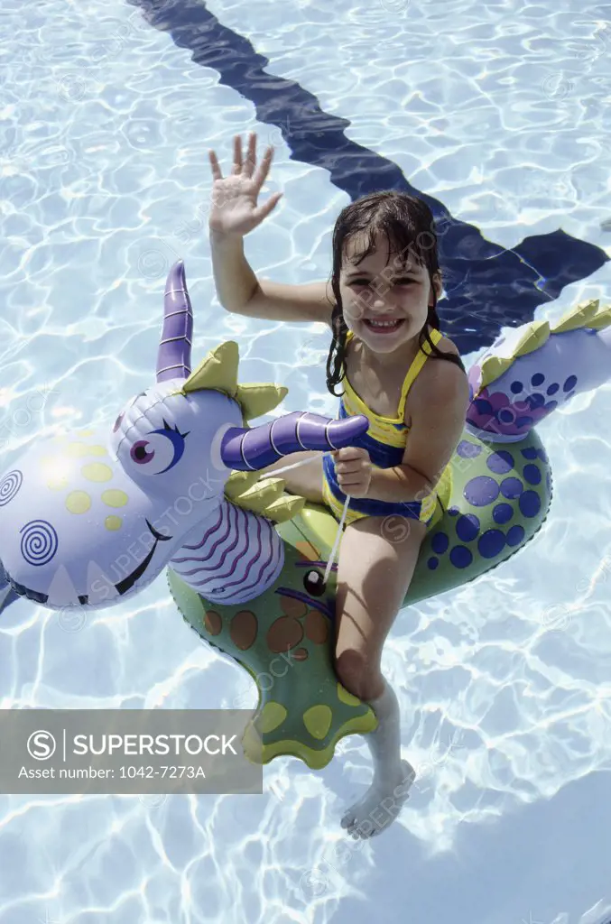 Portrait of a girl sitting on a inflatable ring