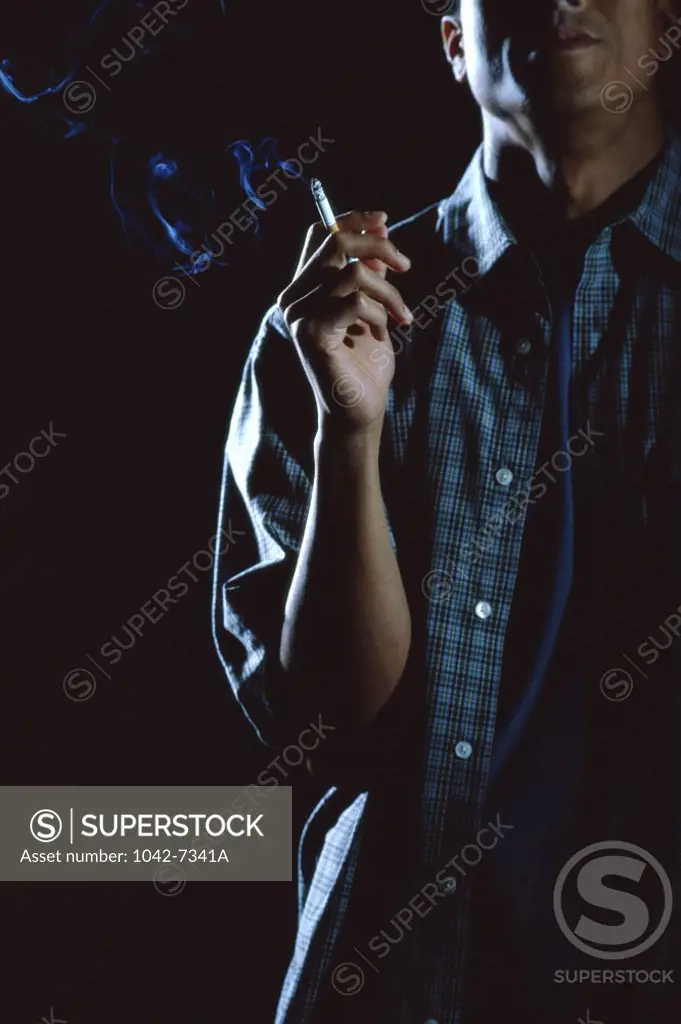 Teenage boy smoking a cigarette