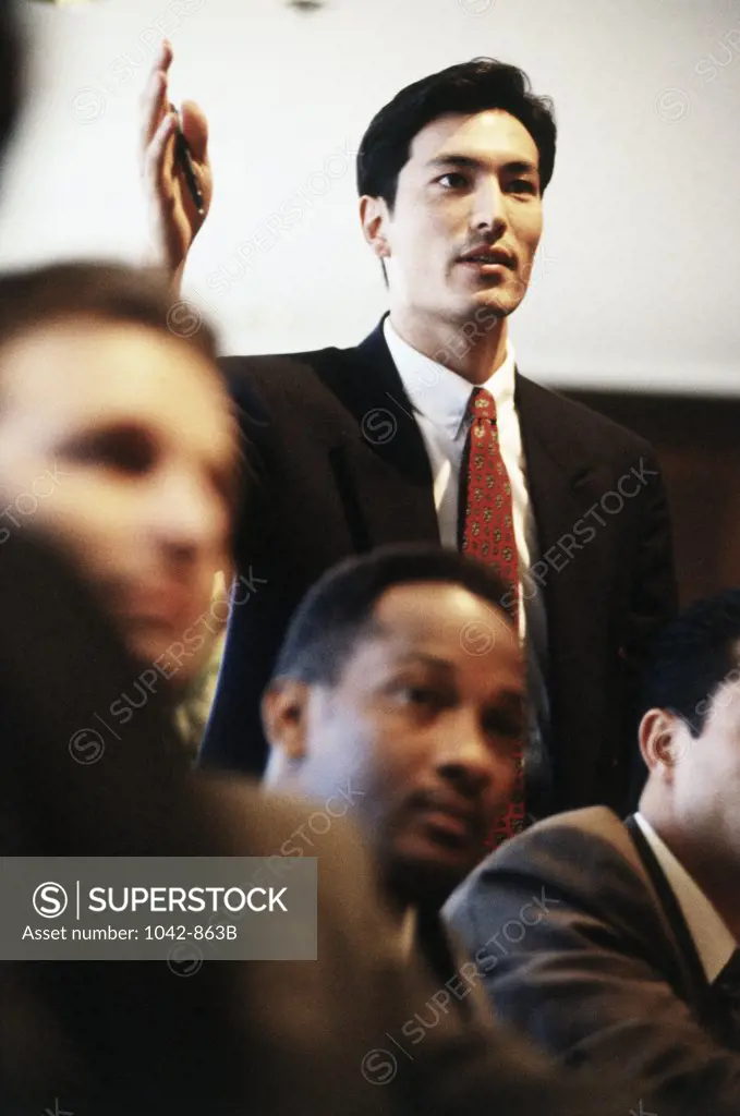 Businessman gesturing in a meeting