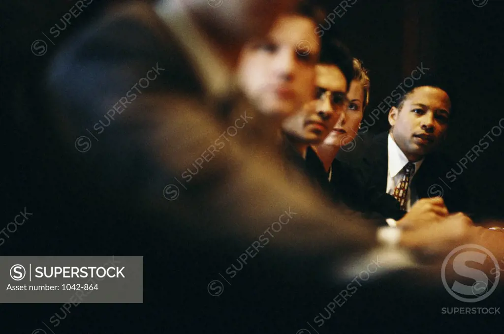 Group of business executives sitting in an office