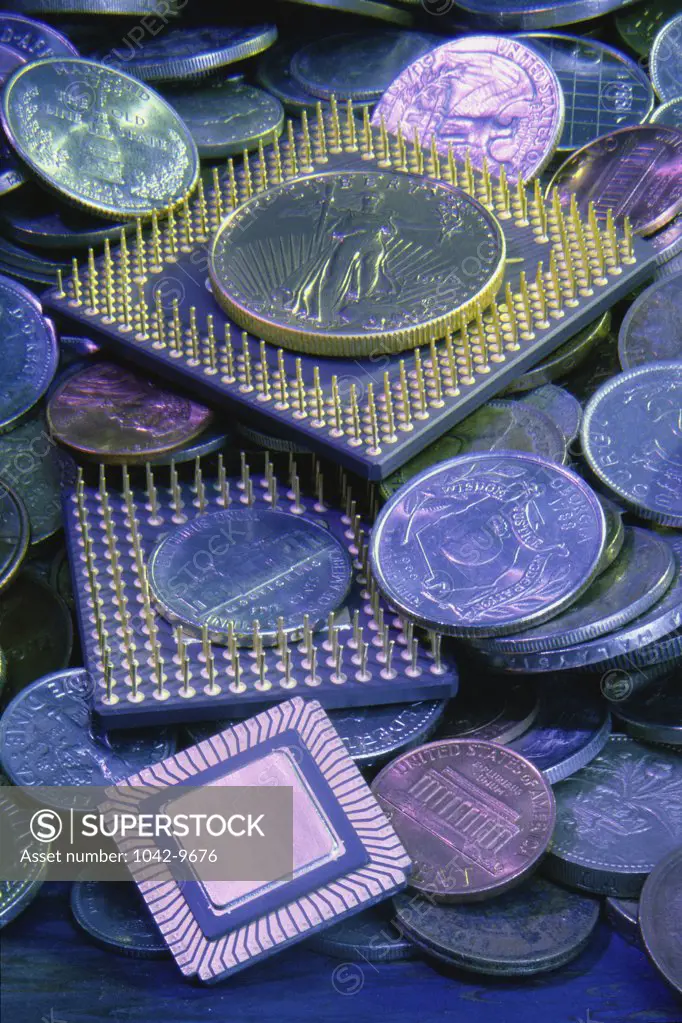 Close-up of computer chips and coins