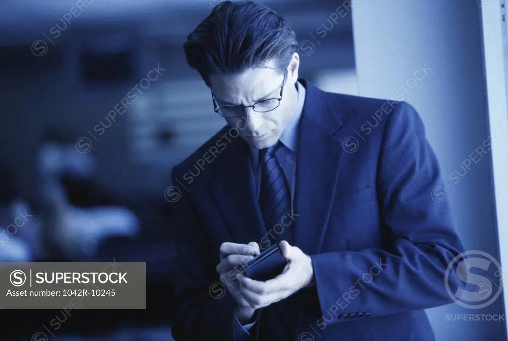 Businessman using a hand held device