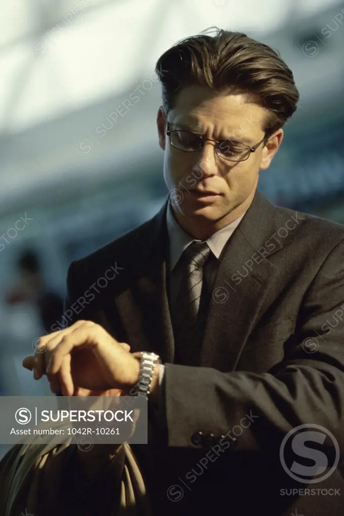 Businessman looking at his wristwatch