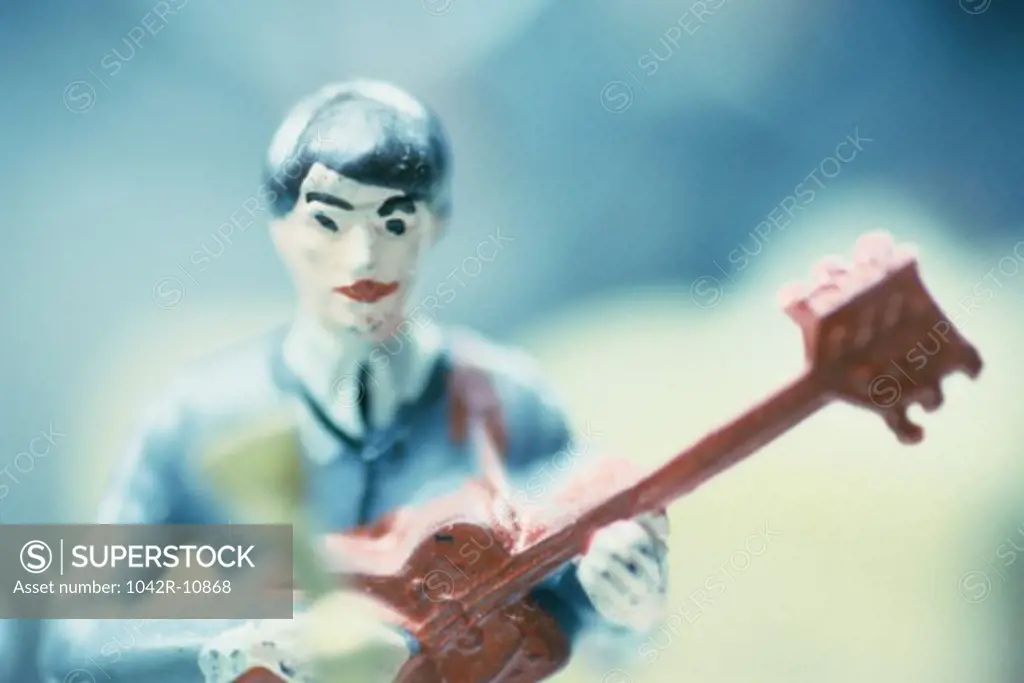 Toy model of a man playing a guitar