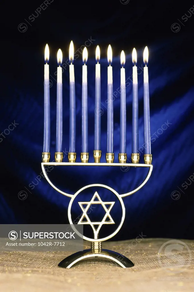Lit candles on a menorah