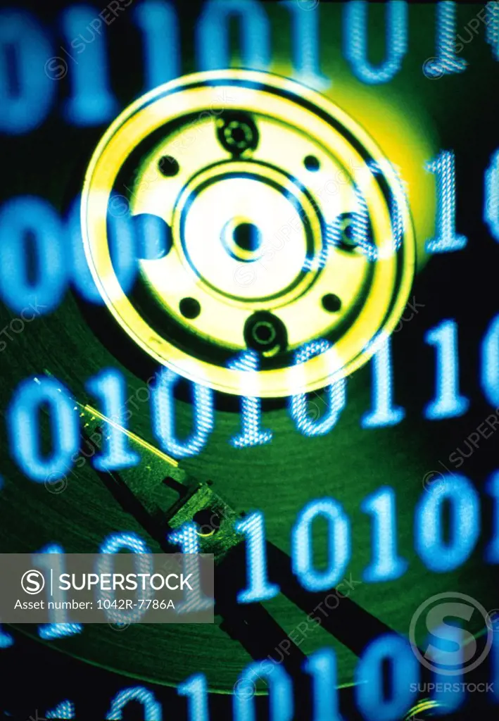 Computer hard drive superimposed over binary code