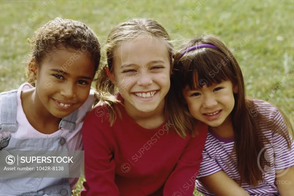 Portrait of three girls smiling