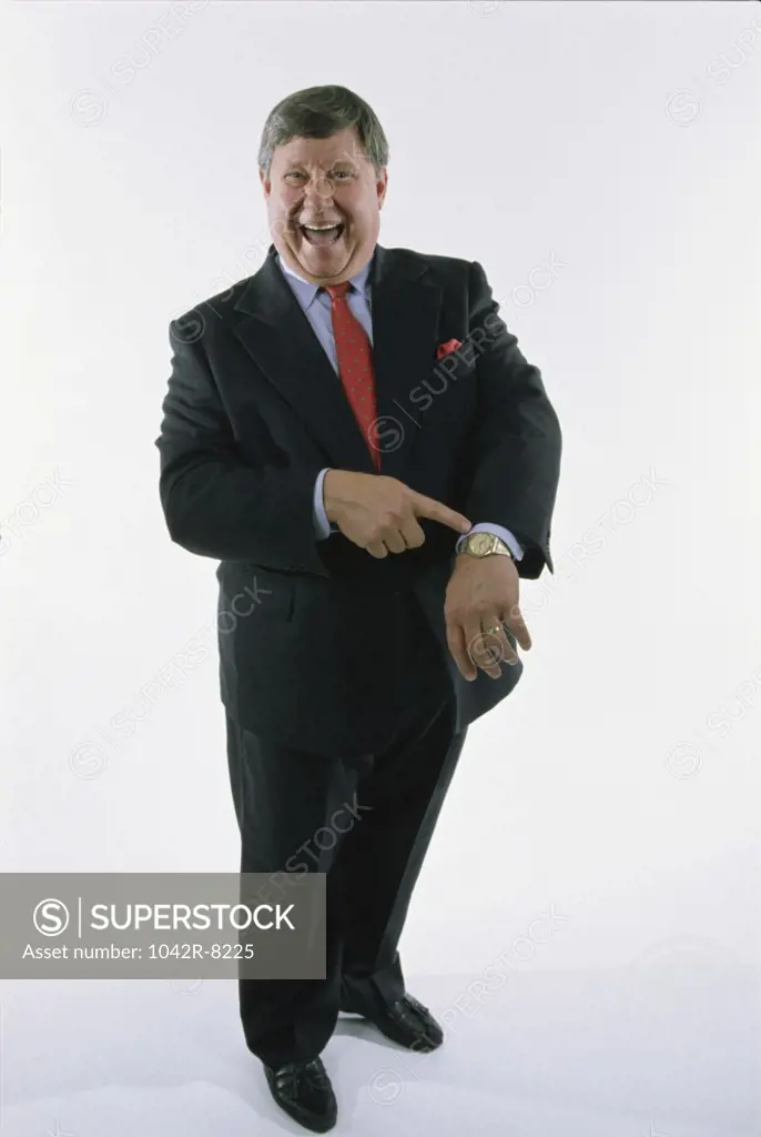 Portrait of a businessman pointing to his wristwatch
