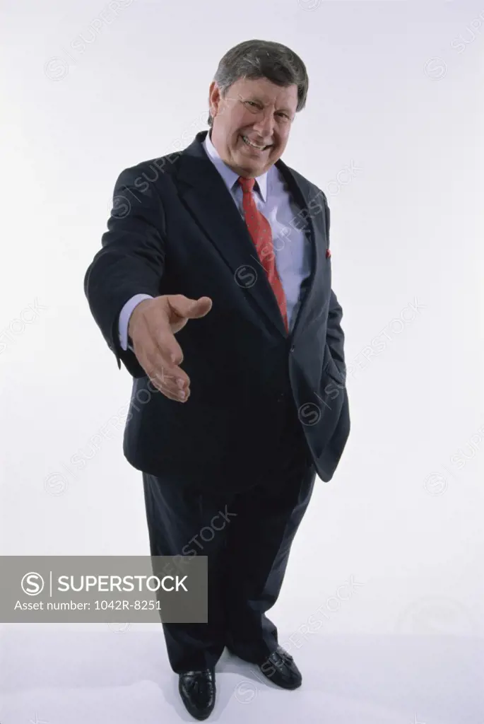 Portrait of a businessman holding out his hand