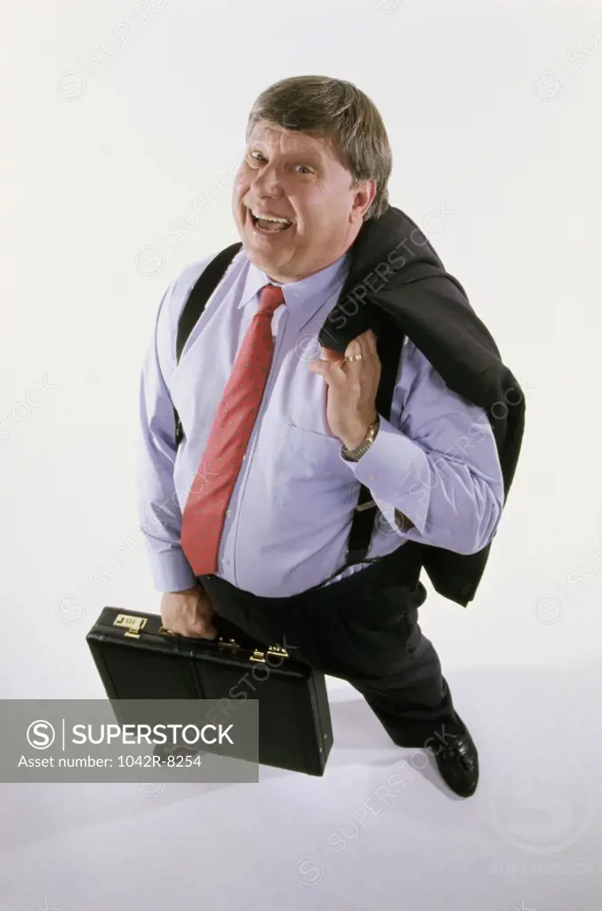 Portrait of a businessman holding a coat and a briefcase