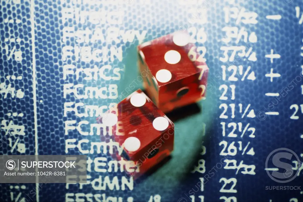 Close-up of a pair of dice on stock market data