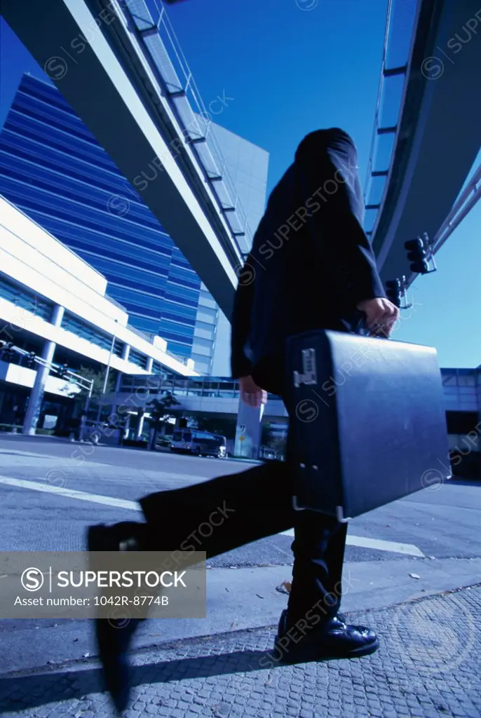 Low angle view of a businessman walking