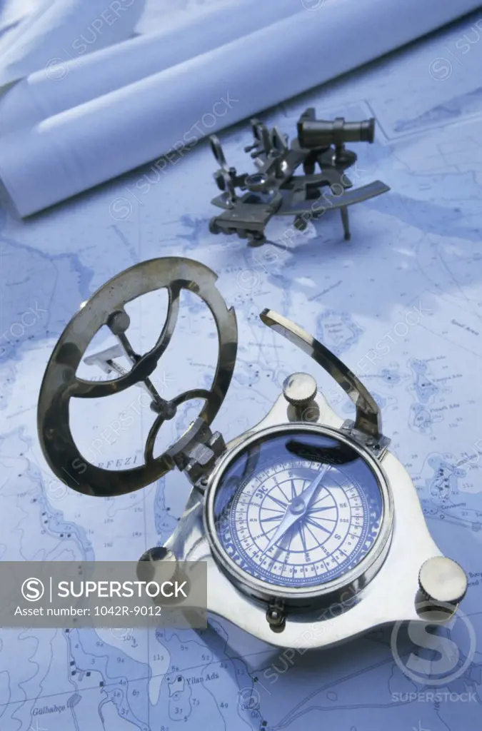 Compass with a sextant and a map