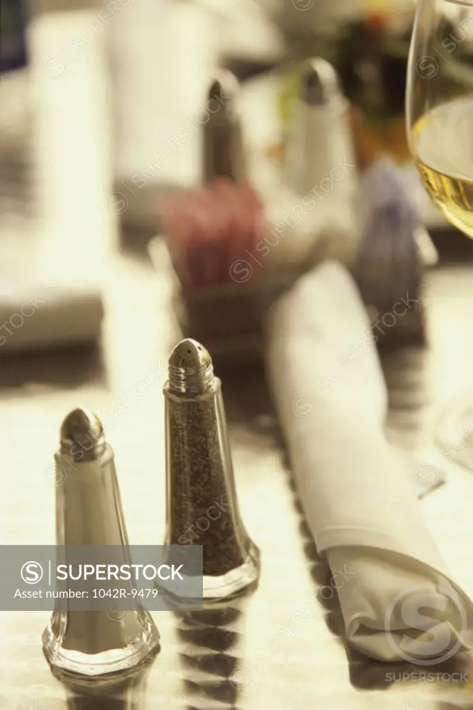 Close-up of salt and pepper shakers on a table
