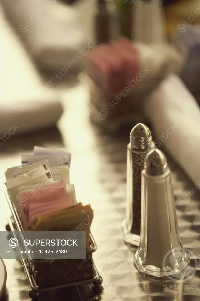 Close-up of salt and pepper shakers on a table