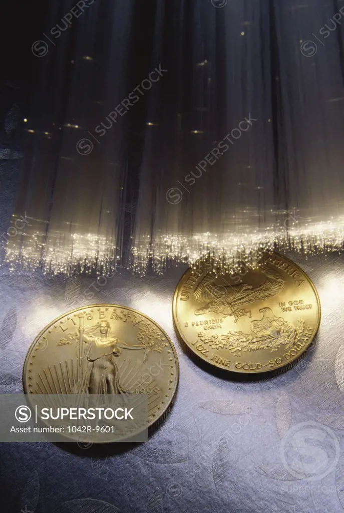 Fiber optics near two gold coins