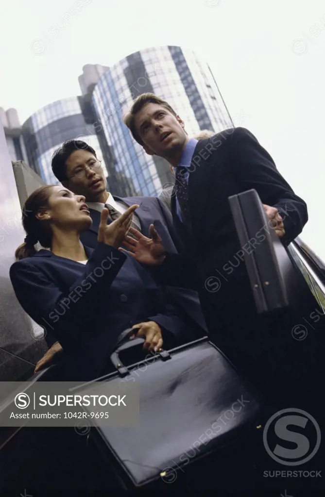 Low angle view of business executives standing together