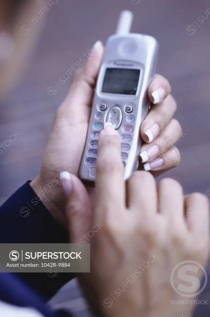 Person operating a mobile phone