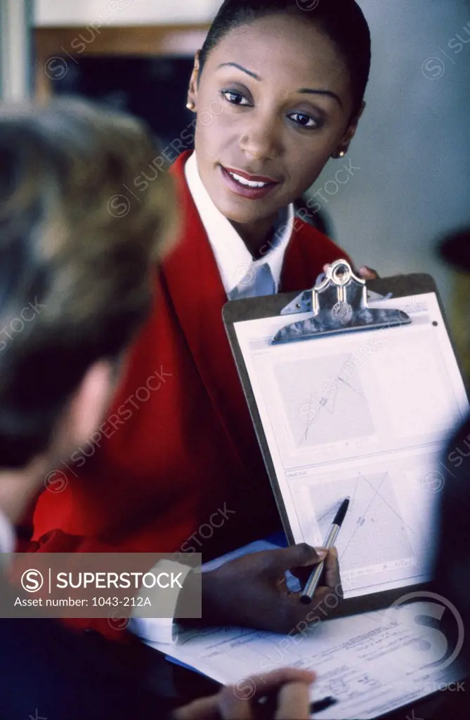 Businesswoman holding a clipboard
