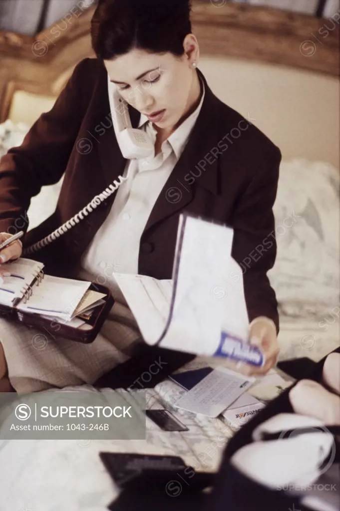 Young businesswoman talking on a telephone