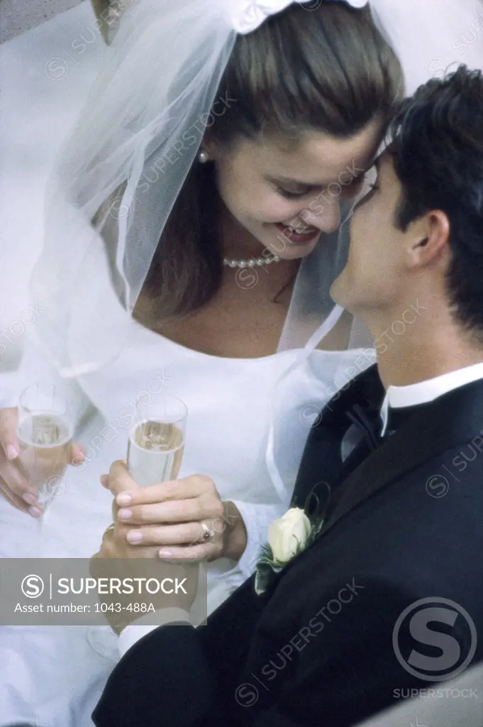 High angle view of a newlywed couple kissing
