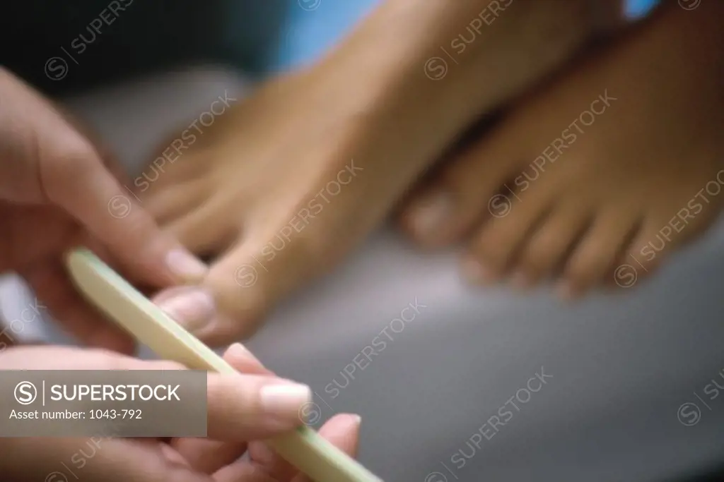 Young woman getting a pedicure